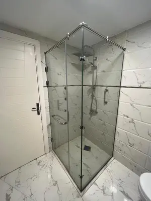 a shower with a glass door in a bathroom at Benashti Hurghada apartment 407 in Hurghada