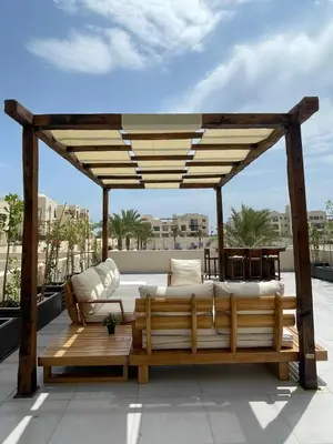 a bed on the roof of a building at ElGouna, Elegant 1Bedroom, private patio in Fanadir Marina in Hurghada