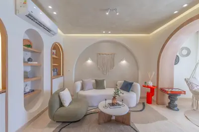 a living room with a white couch and two chairs at Stunning Luxurious 5 BR Villa at West Golf El Gouna in Hurghada