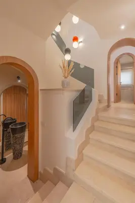 a staircase in a home with a ceiling at Stunning Luxurious 5 BR Villa at West Golf El Gouna in Hurghada