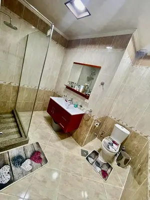a bathroom with a shower and a sink and a toilet at Sahl Hasheesh, El Andalous by sea and pool view, private beach in Hurghada