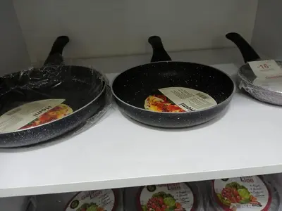 three pans on a counter with food in them at Hossam Cozy Apartment El Hadaba Sheraton in Hurghada