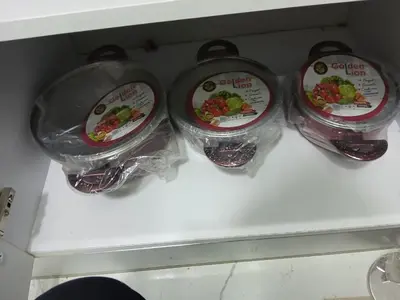 three plastic containers with food inside of a refrigerator at Hossam Cozy Apartment El Hadaba Sheraton in Hurghada
