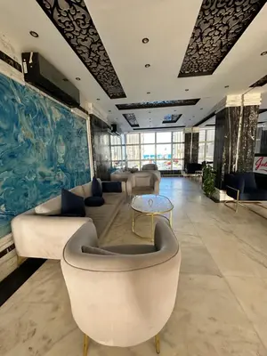 a lobby with couches and a table in a room at Juliana Beach Hurghada in Hurghada