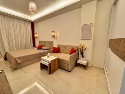 a living room with a bed and a couch at Tolles Modernes Studio in Selena Bay in Hurghada