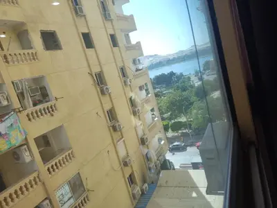a view from the window of a building at Super Elite apartment Nile View F6 in Naj‘ al ‘Amrāb