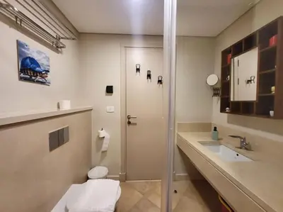 a bathroom with a shower and a toilet and a sink at Mangroovy Serinity 2br pool view in Hurghada