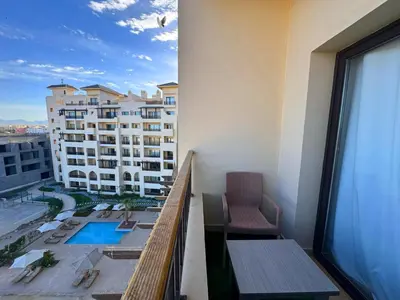 a balcony of a hotel with a view of a building at Aldau Sunset in Hurghada