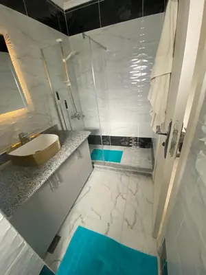 a bathroom with a sink and a shower at Red sea-Cozy one bedroom with sea view in Hurghada