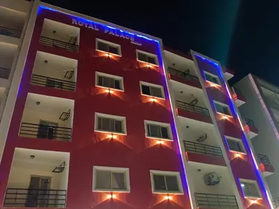 a red and white building with lights on it at Rosa Hotel Hurghada in Hurghada
