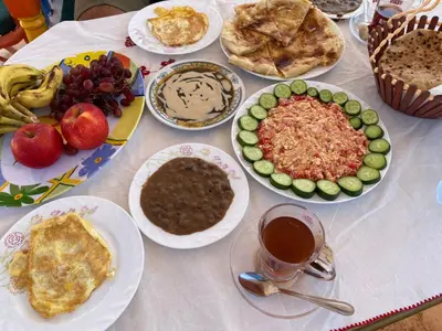 a table with many plates of food on it at La Veranda \u967d\u53f0 in Aswan