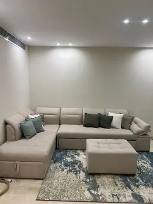 a living room with a sectional couch in a room at Scarab El Gouna in Hurghada