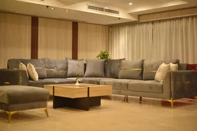 a living room with a couch and two chairs at Hapi V in Aswan
