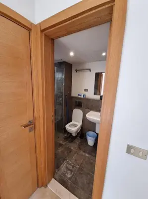 a bathroom with a toilet and a sink at EL GOUNA Scarab Club One bedroom in Hurghada