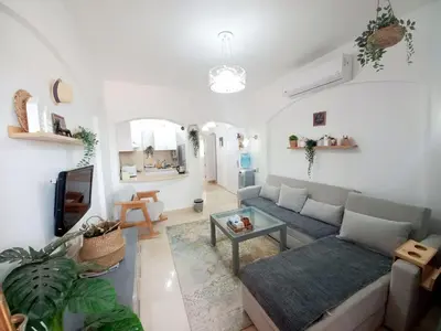 a living room with a couch and a table at Westgolf y 62 1-8 in Hurghada