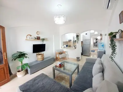 a living room with a couch and a table at Westgolf y 62 1-8 in Hurghada