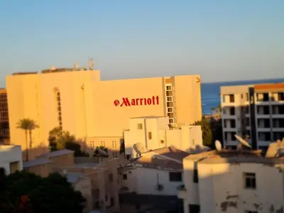 a marriott building with a sign on the side of it at Star house apartments in Hurghada