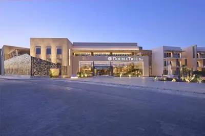 a shopping center with a building in the evening at Doubletree By Hilton Mangroovy El Gouna Resort in Hurghada