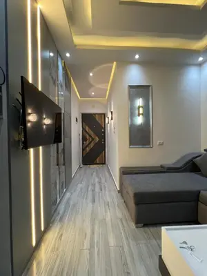 a living room with a bed and a couch at BS Lodging 8- Next to Dream Beach in Hurghada