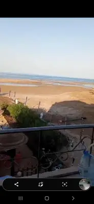 a view of a beach from a balcony with a view at Mo Asha in Safaga
