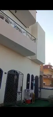 a building with a group of windows and a staircase at Mo Asha in Safaga