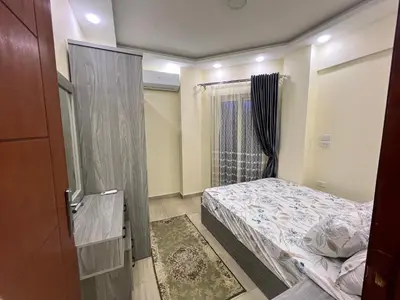 a small bedroom with a bed and a window at Princess Resort Hurghada in Hurghada