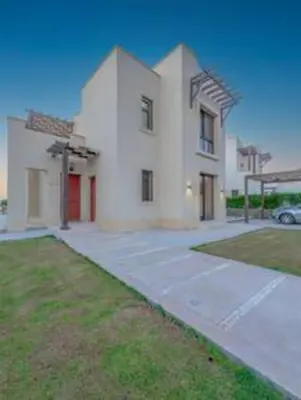 a large white house with a driveway at The Lakefront Villa 4BR at Cyan ElGouna in Hurghada