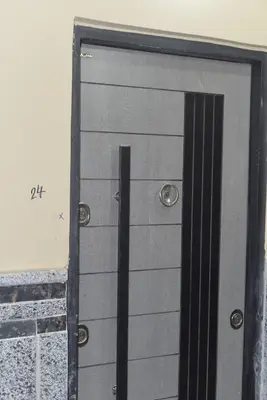 a pair of metal garage doors on a building at برج النيل بزنس in Jazīrat al ‘Awwāmīyah