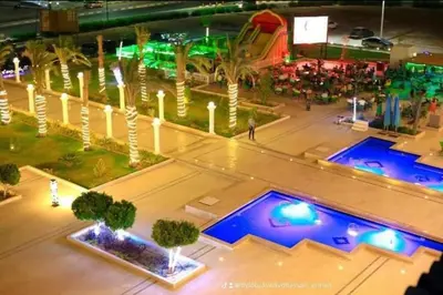 an overhead view of a pool at a resort at night at Hurghada Hub in Hurghada