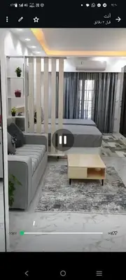 a living room with a couch and a table at Juliana beach in Hurghada