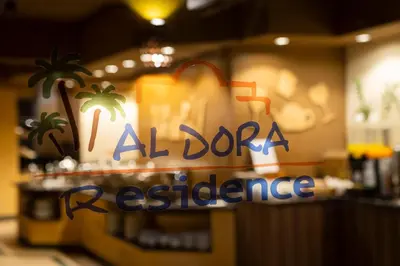 a sign for a restaurant with a palm tree at Al Dora Resort All Inclusive Hotel in Hurghada