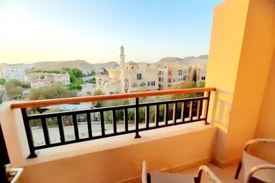 a balcony with a view of a city at Jomana Aldau Heights Hurghada rent one bedroom apartment in Hurghada