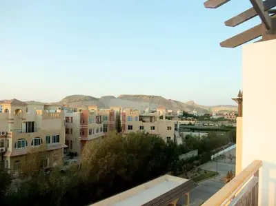 a view of a city from a balcony at Jomana Aldau Heights Hurghada rent one bedroom apartment in Hurghada