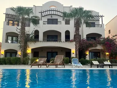 a hotel with a swimming pool in front of a building at El gouna , Red sea in Hurghada