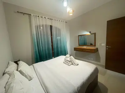 a bedroom with a bed with two towels on it at El gouna , Red sea in Hurghada
