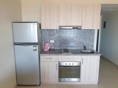 a kitchen with a refrigerator and a sink at Studio for rent 202 in Hurghada