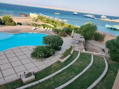 an aerial view of a swimming pool next to the beach at Studio for rent 202 in Hurghada