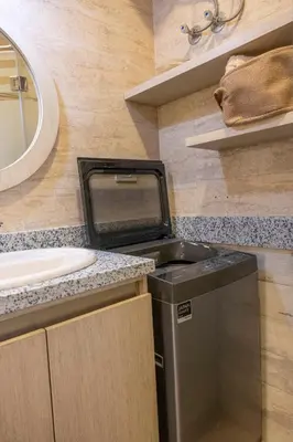 a bathroom with a sink and a trash can at Studio Serenity Downtown El Gouna in Hurghada