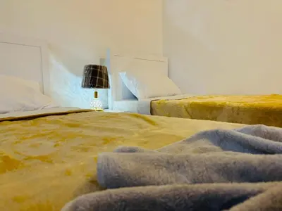 two beds sitting next to each other in a bedroom at Luxor View Hotel in Luxor