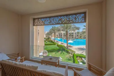 a large window with a view of a resort at Elegant 2BR Plus Nanny Room in Mangroovy Gouna in Hurghada
