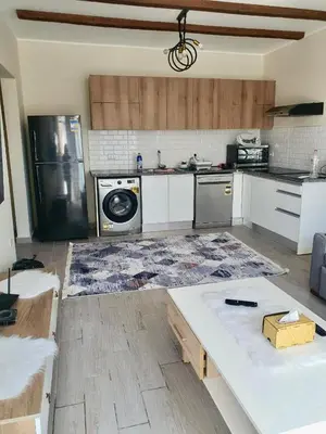 a kitchen with a stove and a refrigerator at Bali D-28 in Hurghada