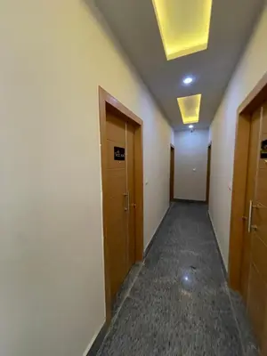 an empty hallway with two doors and a ceiling at Elamer building in Hurghada