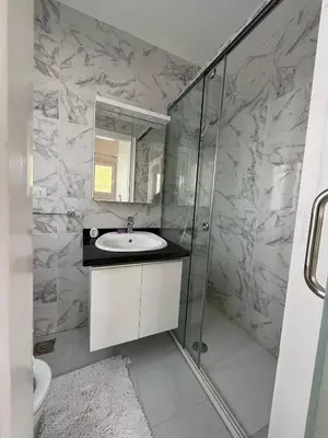a bathroom with a sink and a shower at white villa 4 bedroom elgouna heated pool in Hurghada