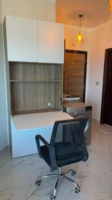 a office with a desk and a chair in a room at Luxurious and Cozy Seafront Studio Near Gouna in Hurghada