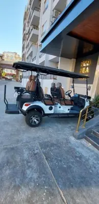 a golf cart parked next to a building at Zahabia Golden Beach Resort Down Town in Hurghada