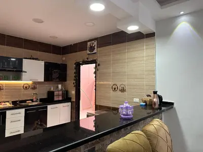a kitchen with a black counter top in a room at Tulip residence villa 1 in Hurghada