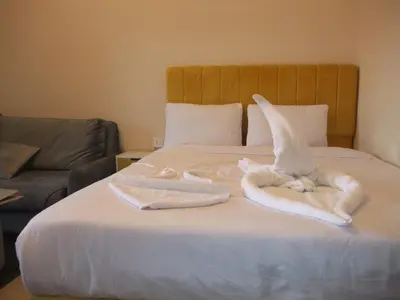 a bedroom with a bed with towels on it at new in Hurghada