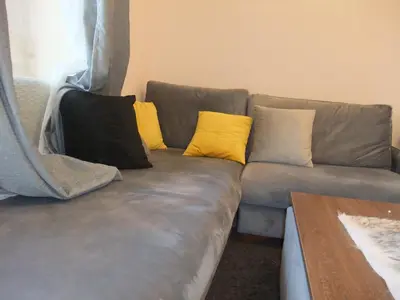 a couch with yellow and black pillows on it at new in Hurghada