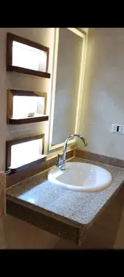 a bathroom counter with a sink and a mirror at شاليه ميراج باى in Hurghada