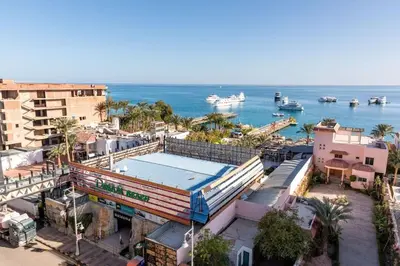an overhead view of a city with boats in the water at Daily rent studio pool view in Hurghada